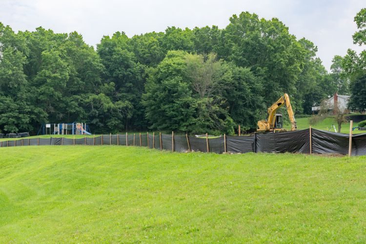 Protecting Our Communities and Waterways: Silt Fence Installation at Work